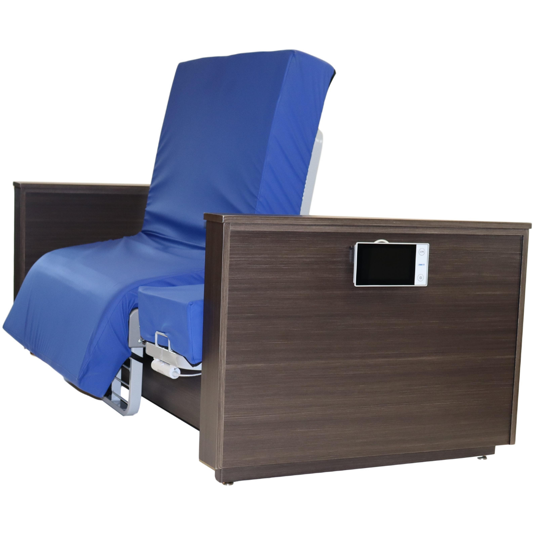 The Med-Mizer ActiveCare Rotating Hospital Bed features a blue mattress, partial recline, dark wood panels, and a side-mounted control screen.